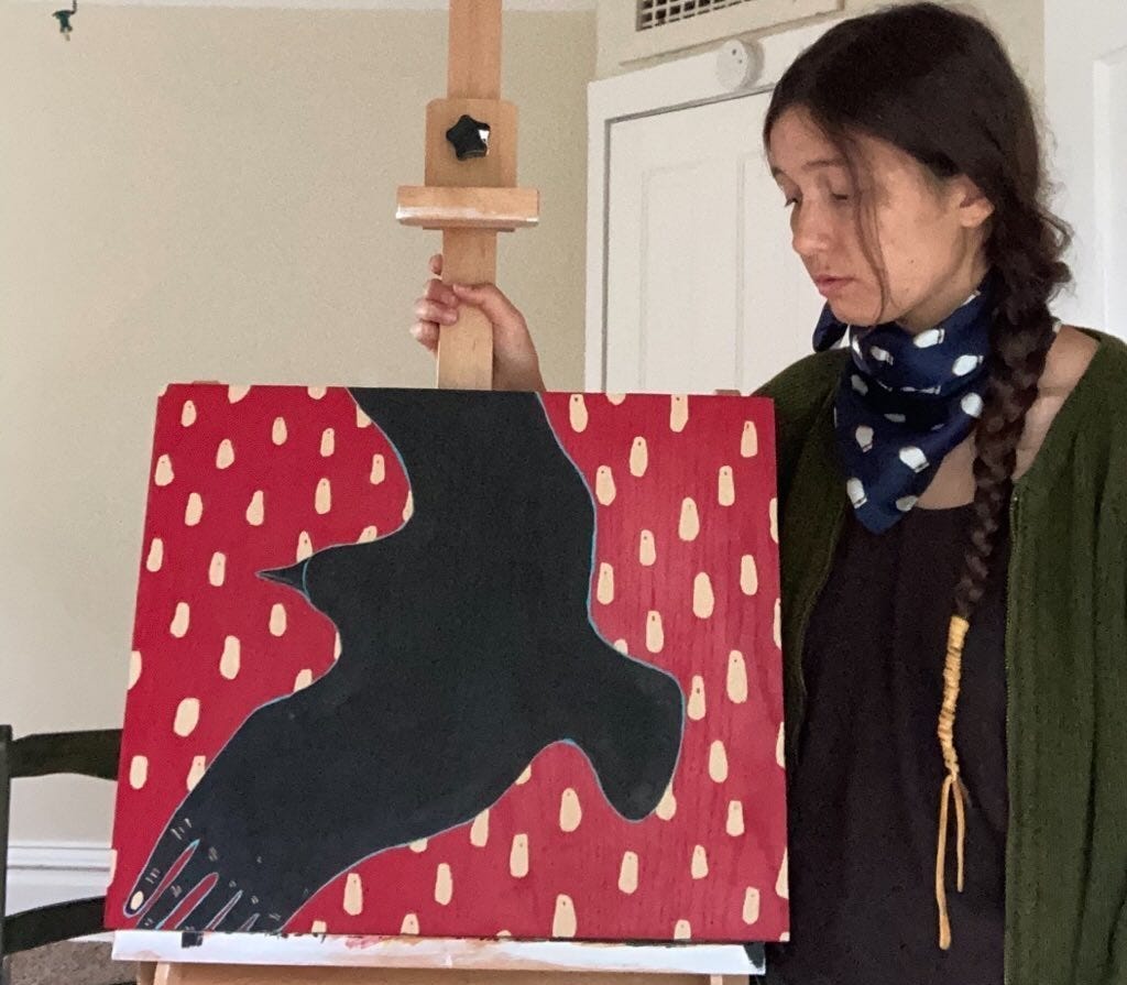 woman in bandanna in front of red canvas