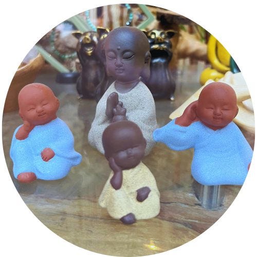 Thumbnail image of miniature Buddha figurines