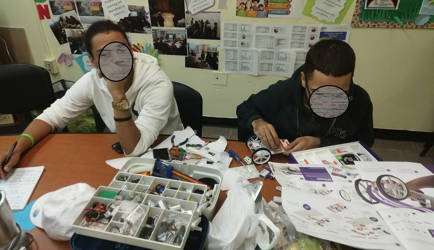 2 high school students building robots 2 high school students building robots