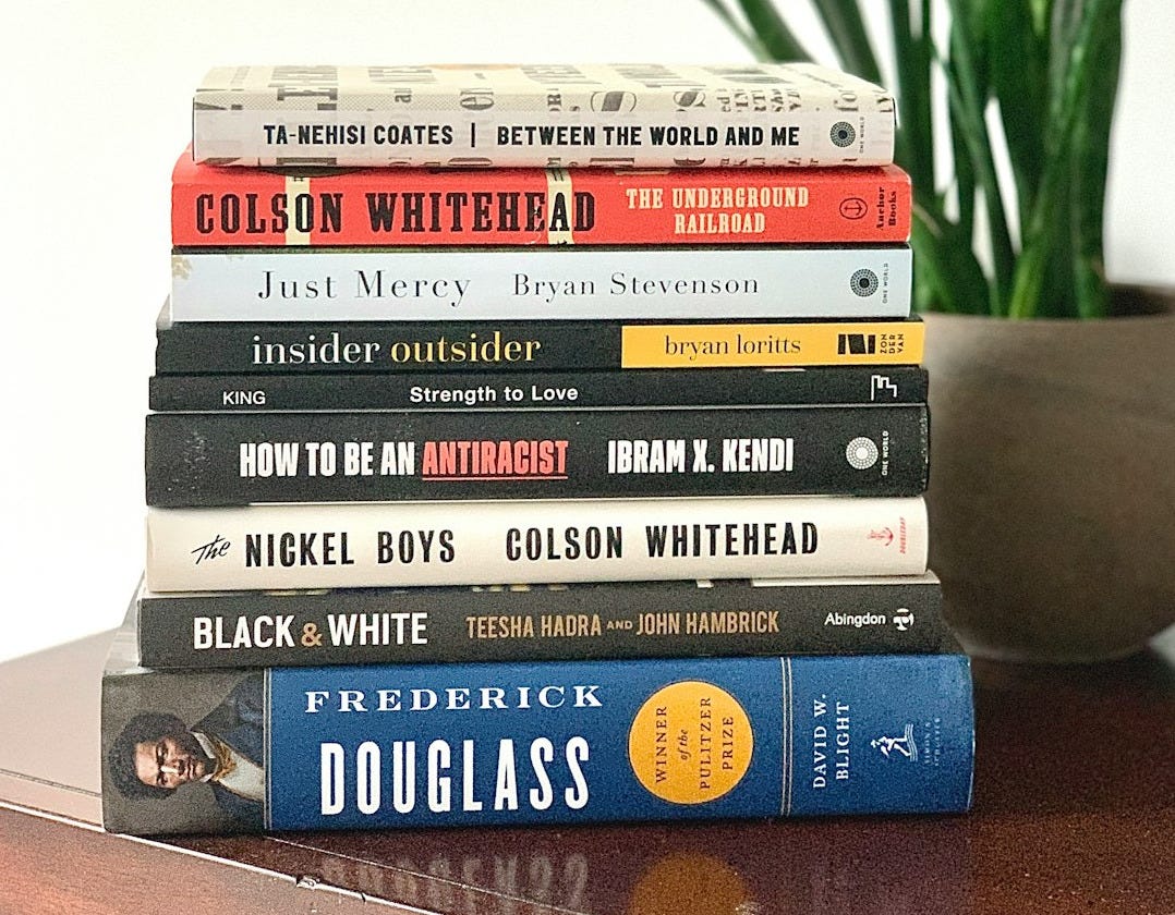 stack of books on white table