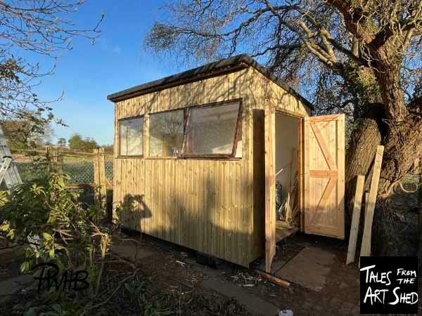 Newly recladded shed complete with new wooden doors