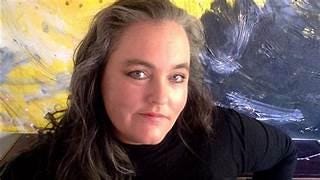 A person with long hair and a black shirt
Description automatically generated A person with long hair and a black shirt
Description automatically generated