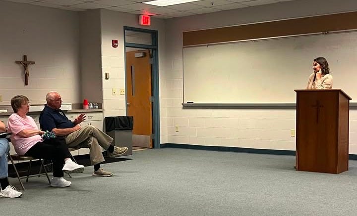 May be an image of 4 people and people studying