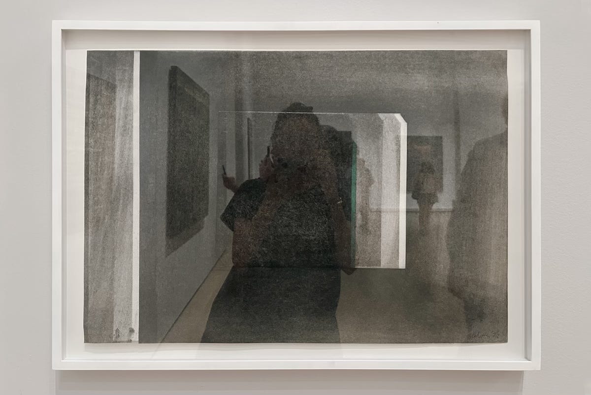 self portrait through a reflection