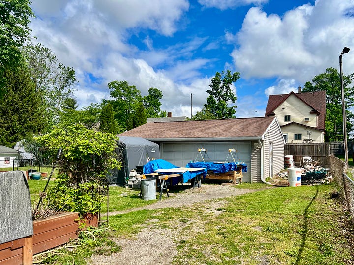 The Million Dollar Garage stands at the ready...a pile of purged trash ready to be removed...a semi studio set up outside ready to be used until the rebuild begins...the garden ready to be planted...and the patio ready to be used in the way patios are used during the Michgan summer