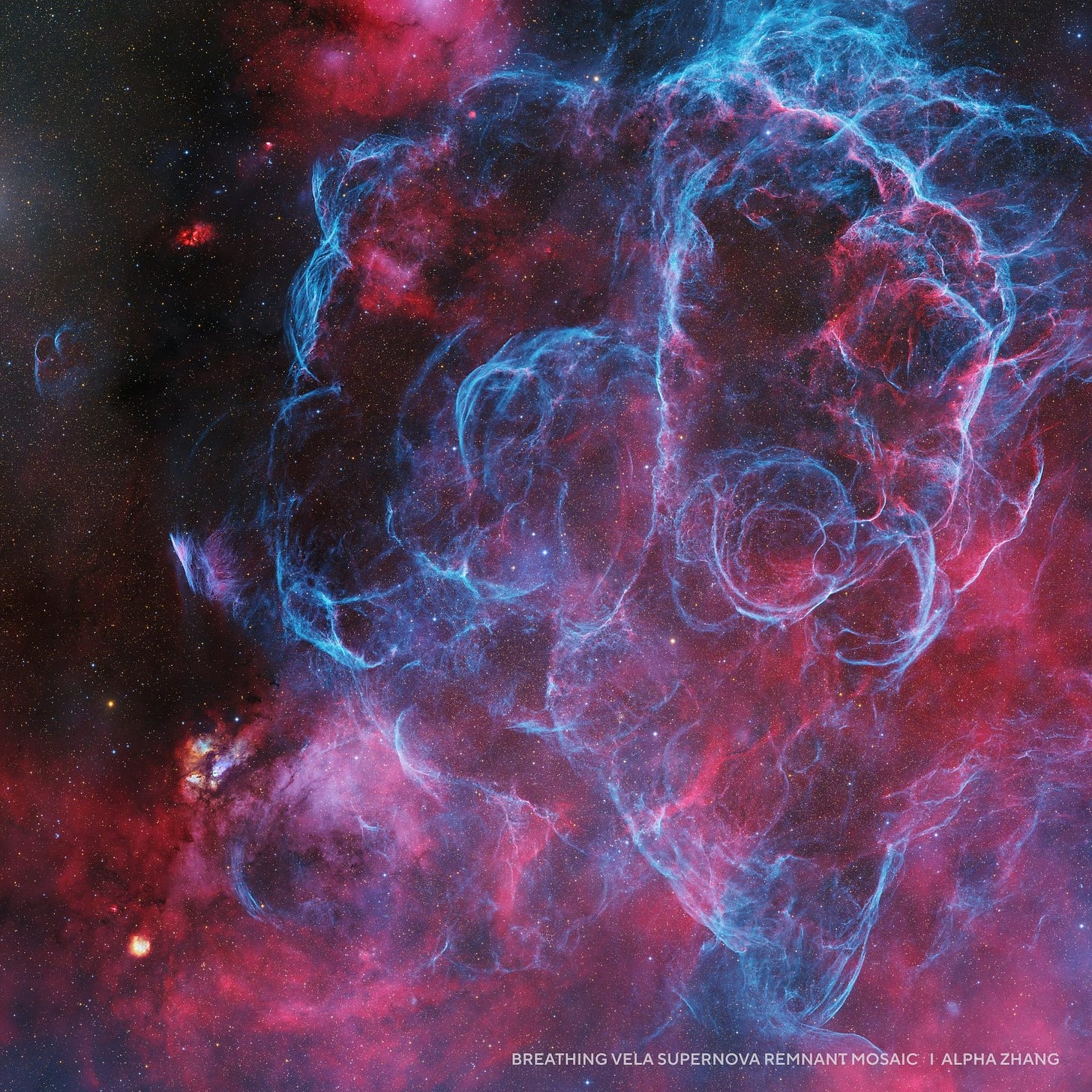 Colorful nebula with bright blue and pink swirling gas clouds in deep space, depicting the Vela supernova remnant mosaic—an inspiring feature among 2025 night sky images.