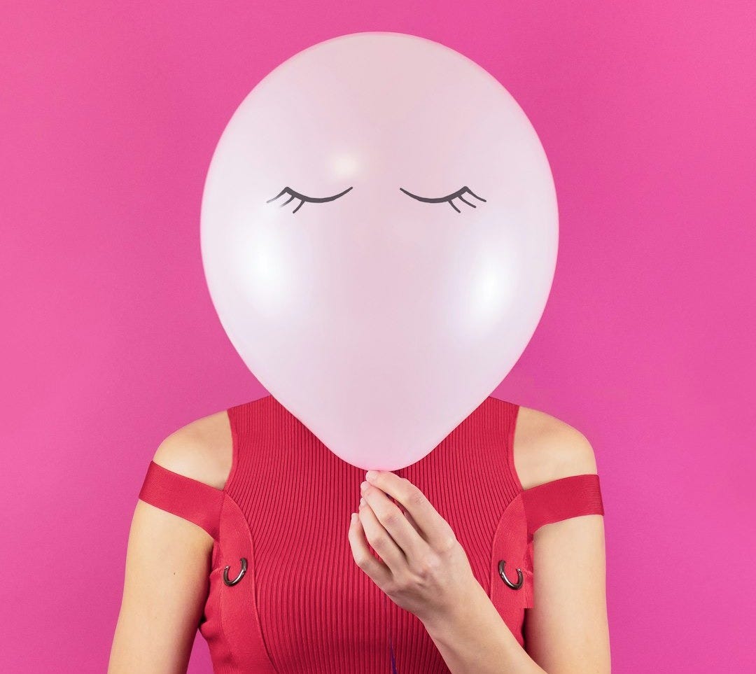woman holding balloon woman holding balloon