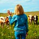 She Waves at Cows