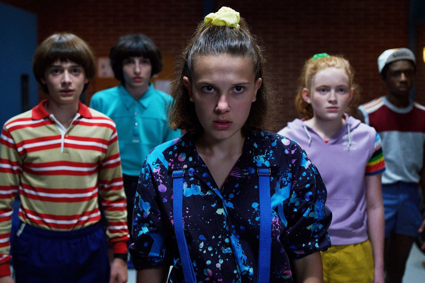 Will, Mike, El, Max and Lucas from Stranger Things Season 3 dramatically standing in formation.