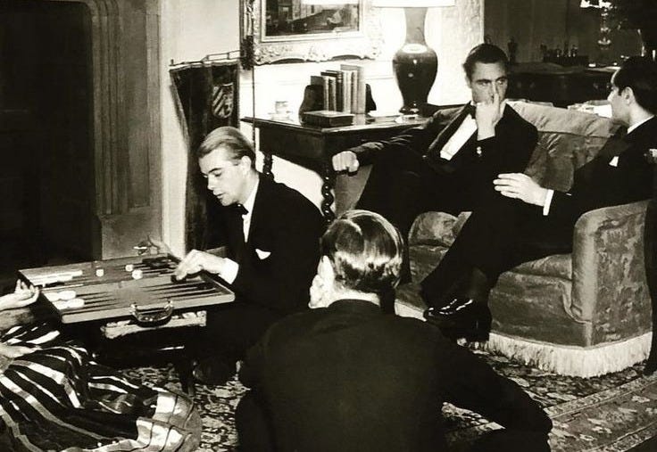 This may contain: black and white photograph of three men sitting in a living room This may contain: black and white photograph of three men sitting in a living room