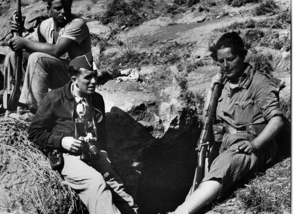 Agustí Centelles: The Man With the Suitcase illustrated by a man with a camera.