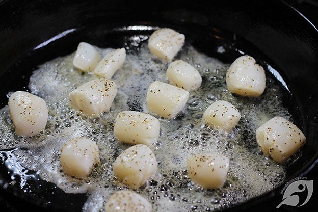 Heat the skillet over medium-high to high heat until it’s hot; add 1 tablespoon Roasted Garlic Grapeseed Oil and heat until the oil begins to shimmer. Place the scallops in the pan with 1 tablespoon of butter, leaving enough space so they don’t steam each other. Work in batches if necessary.