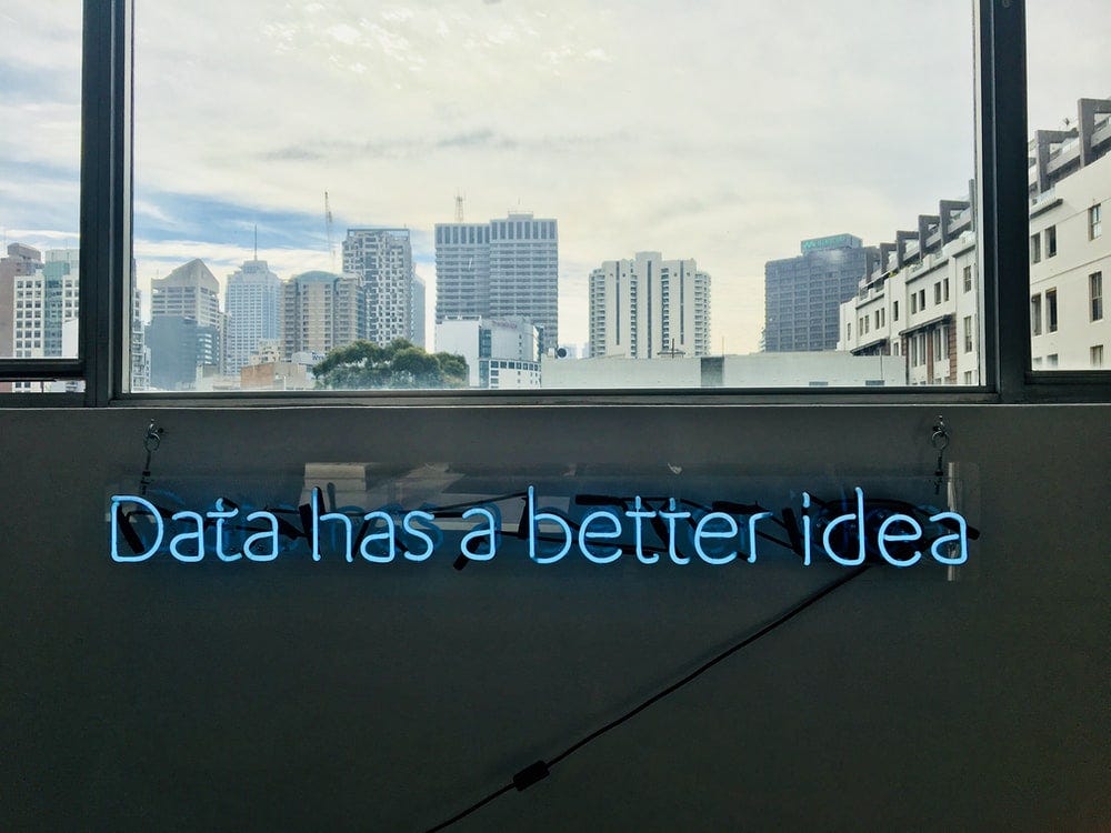 white building with data has a better idea text signage white building with data has a better idea text signage