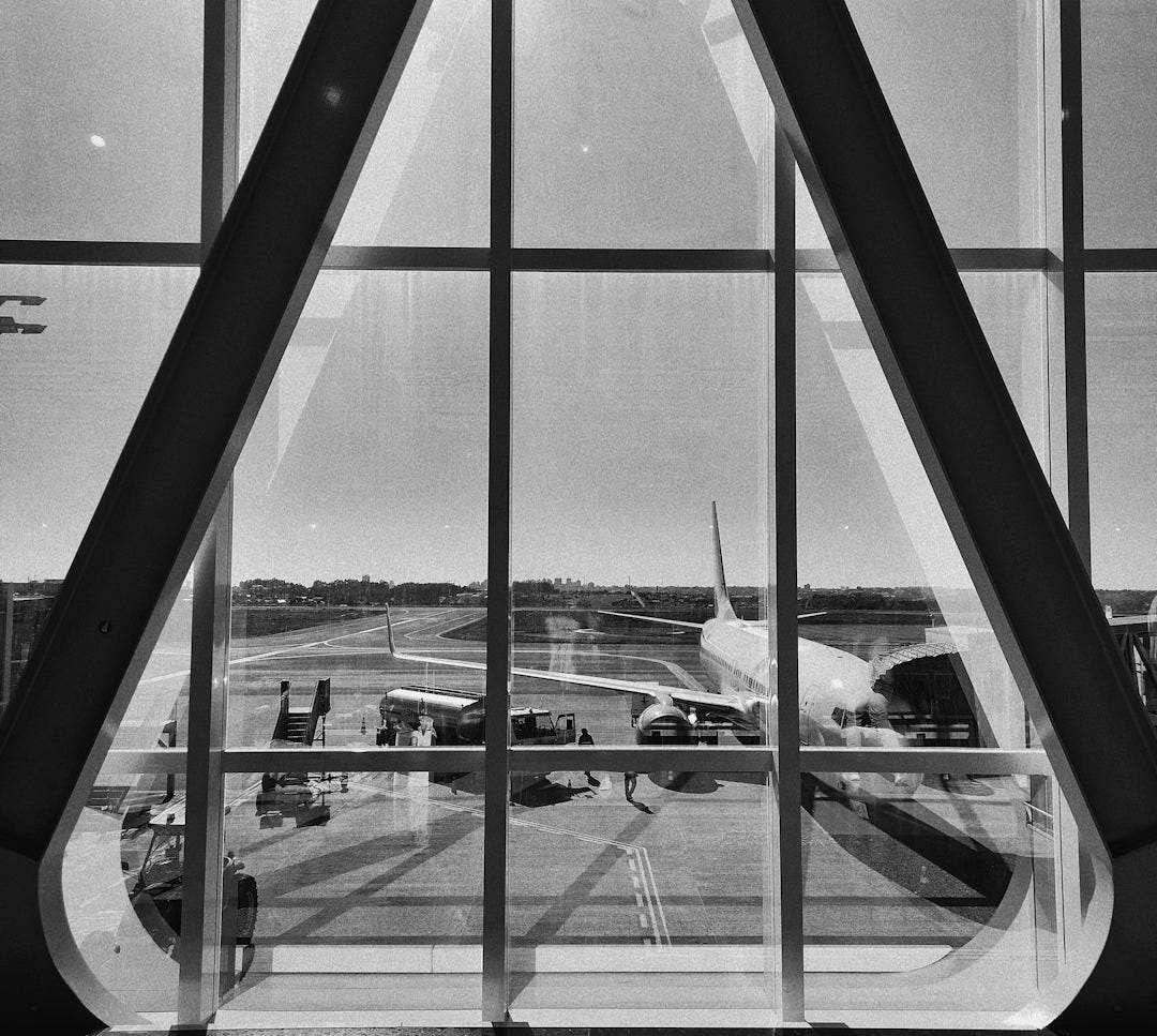 a black and white photo of an airport