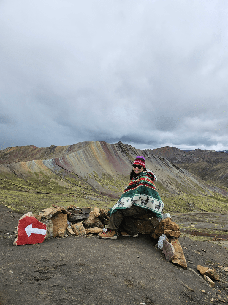 Solo female traveler enjoying Palcoyo mountain after a strenuous hike Solo female traveler enjoying Palcoyo mountain after a strenuous hike