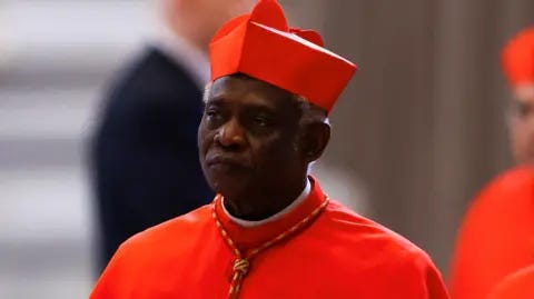 Reuters Cardinal Peter Turkson in red biretta and soutane
