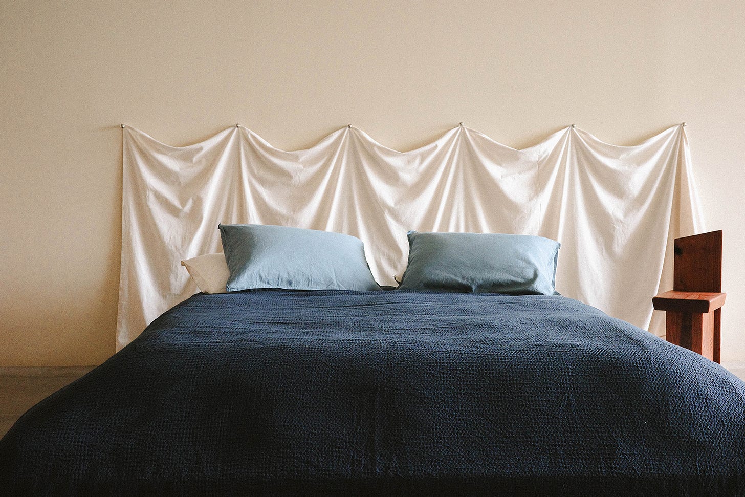 Bed in blue bedspread