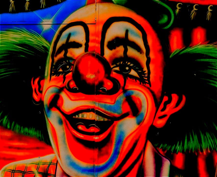 man with green and blue face paint