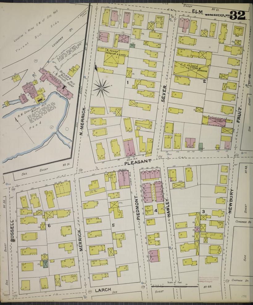 Plate 32 from the 1892 Sanborn fire map of Worcester, MA. The map shows buildings, colored in yellow or pink, and an inset of a pond surrounded by large manufacturing buildings