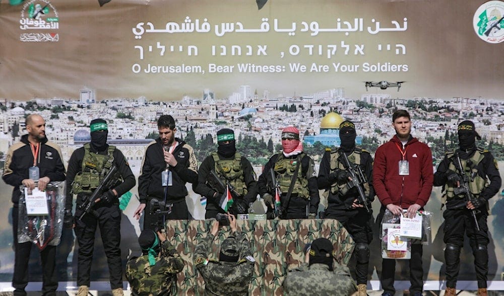 Israeli captives are escorted by Hamas and Islamic Jihad fighters on a stage before being handed over to the Red Cross in Khan Younis, southern Gaza Strip, Saturday Feb. 15, 2025. (AP) Israeli captives are escorted by Hamas and Islamic Jihad fighters on a stage before being handed over to the Red Cross in Khan Younis, southern Gaza Strip, Saturday Feb. 15, 2025. (AP)