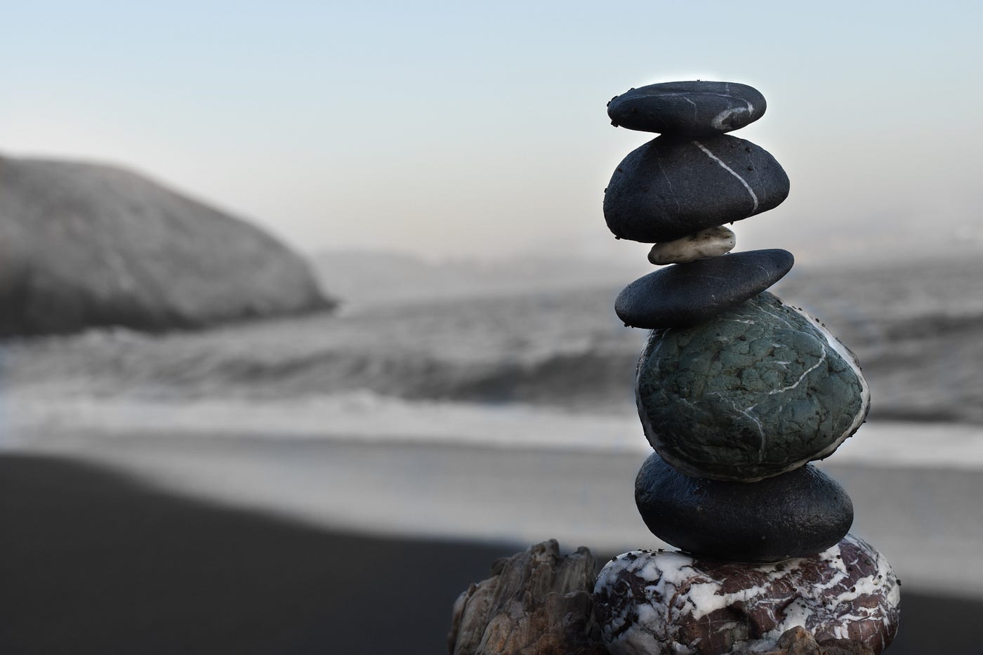 Zen — stones on top of each other, at the beach. Calm balance.