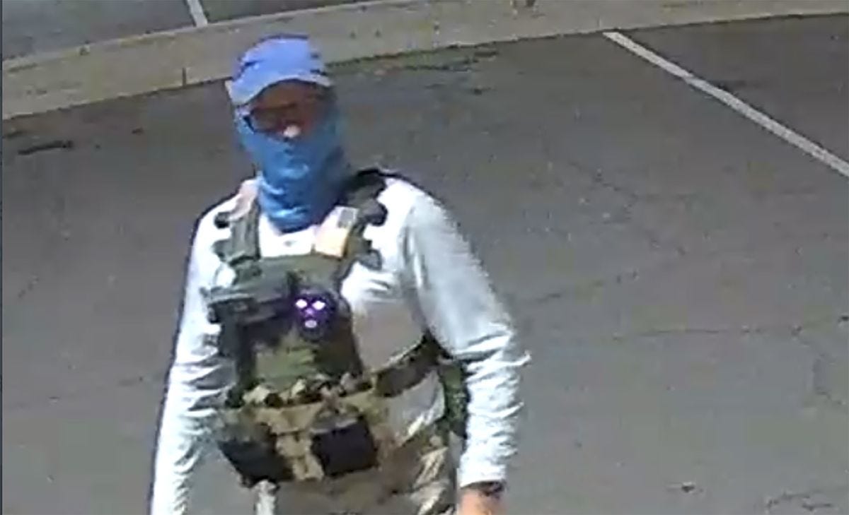 Masked Poll Watchers Show Up at Voting Sites With Handguns, Kevlar Vests -  Bloomberg