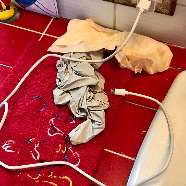 LEFT: Photograph of a plastic glove wadded up on the red-tiled bathroom counter. The shape resembles the face of the witch. A lighting cable crosses over and winds around from where it’s plugged in above.  RIGHT: Detail from RHEA THE WITCH featuring her aged, wrinkled face in profile. Shadows from her hood fall over her eyes and across her cheek. Her mouth is open to expose thin, uneven teeth, rotting to well-spaced stubs.