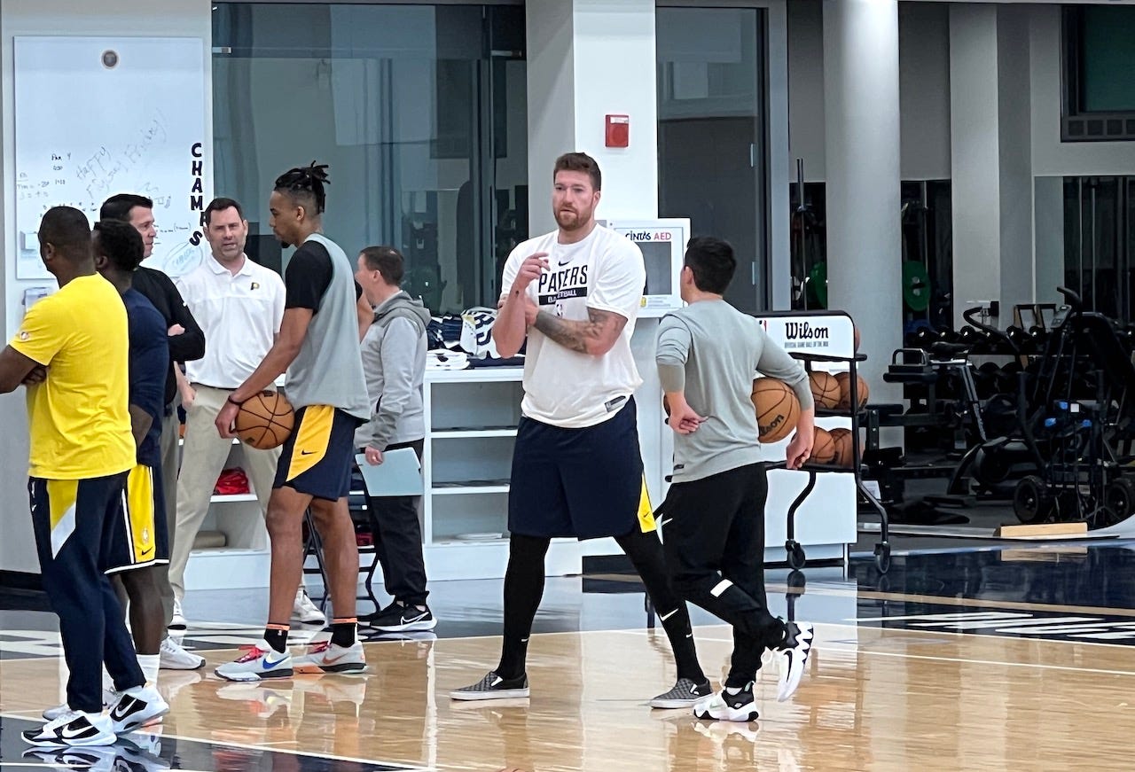Shayne Whittington talks to Mad Ants assistant Justin Wetzel after a pre-draft workout.