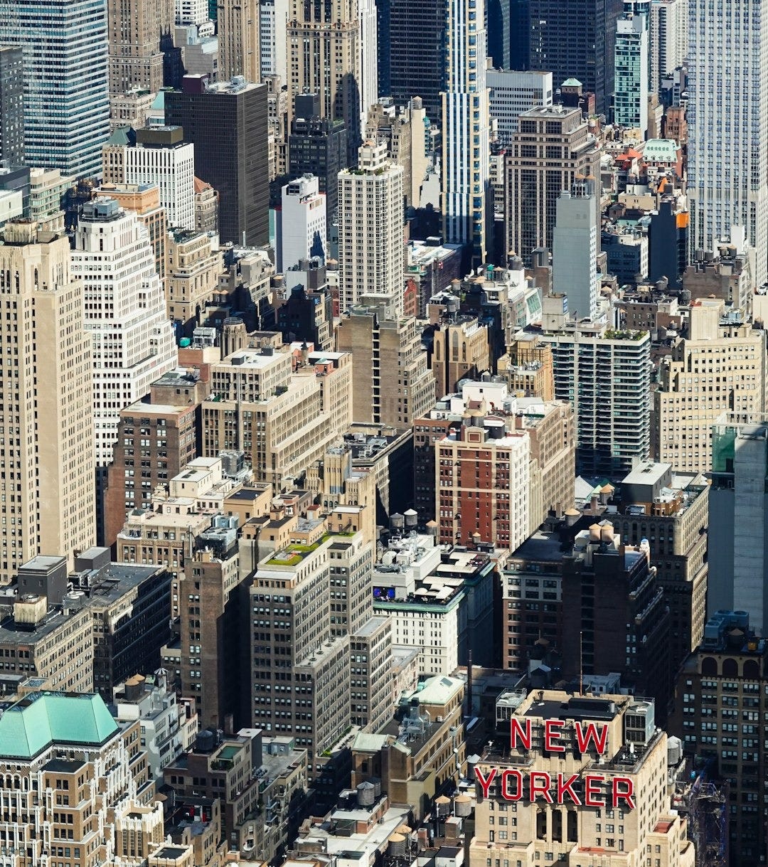 aerial view of city buildings during daytime aerial view of city buildings during daytime