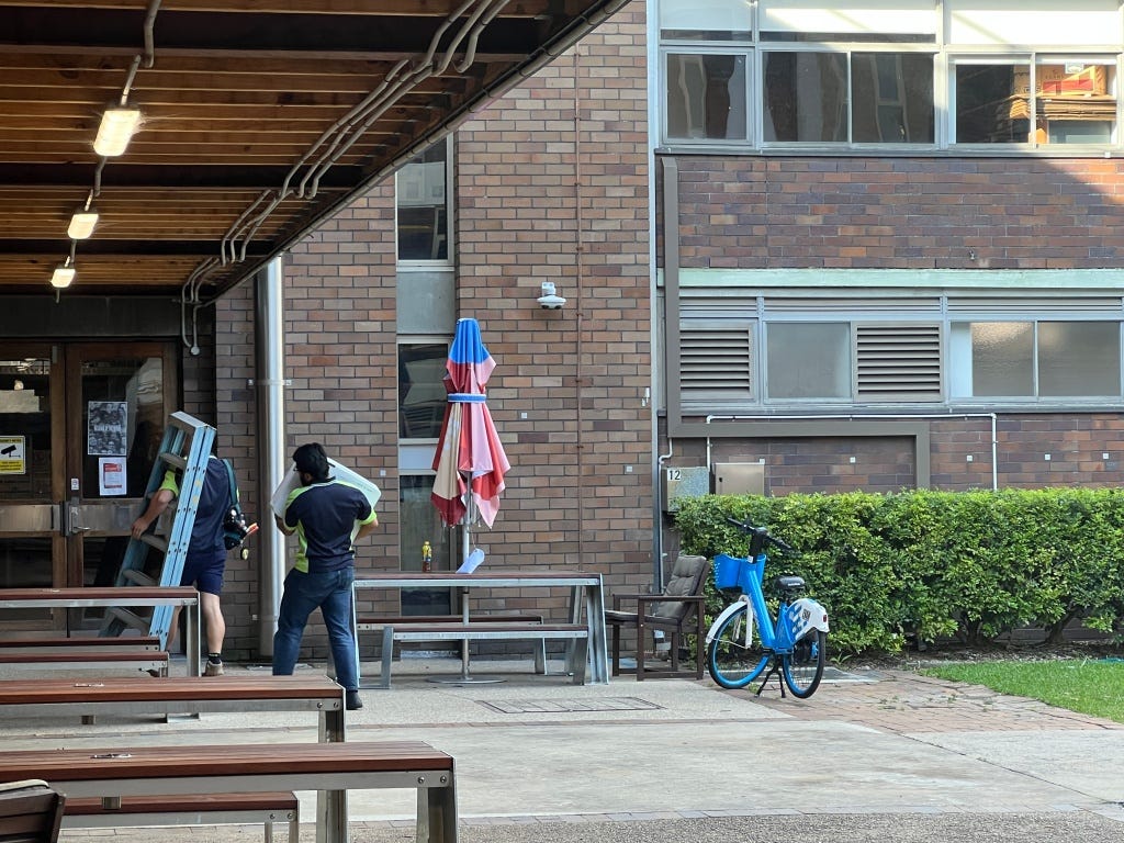 On campus in the middle of some buildings.
