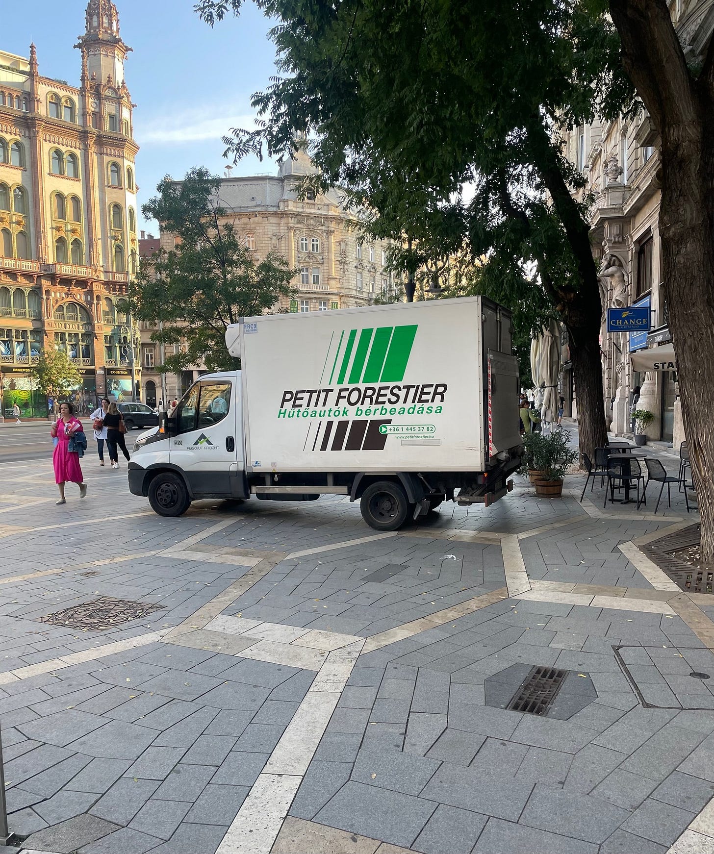 May be an image of 3 people, service vehicle and text