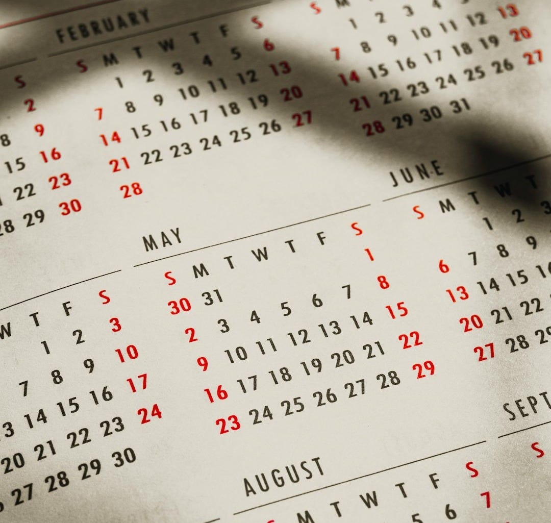 a close up of a calendar on a table a close up of a calendar on a table
