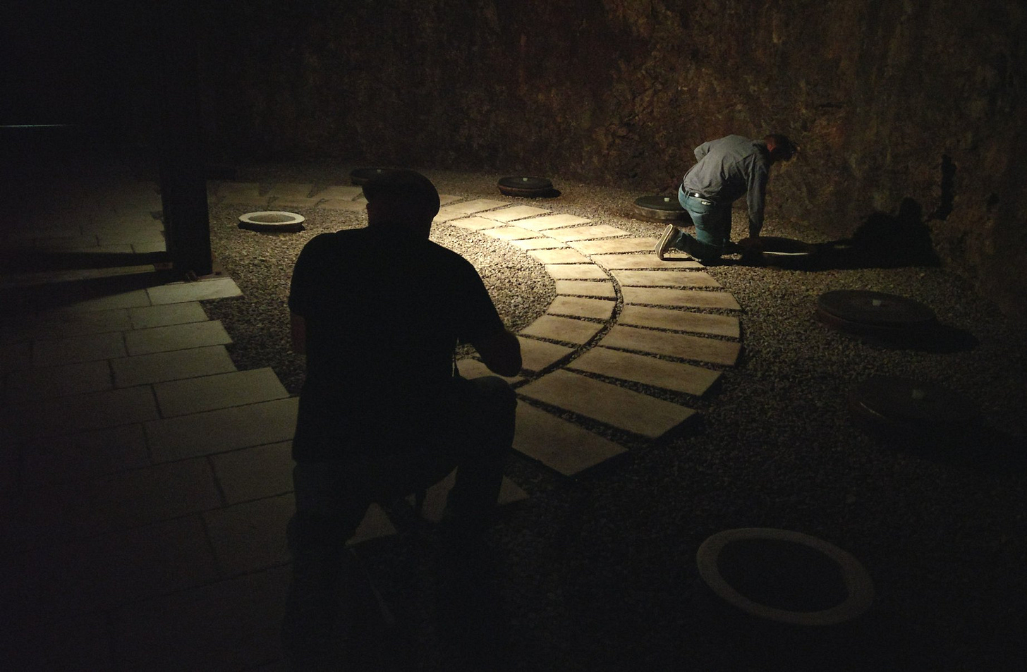 Ryan Opaz shoots Paolo Vodopivec crouching over a qvevri (Photo (C) Simon Woolf)