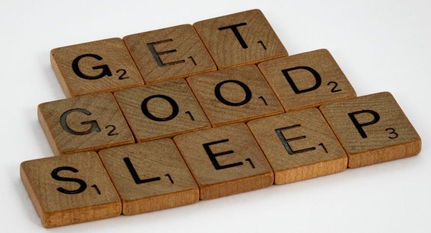 brown wooden letter blocks on white surface