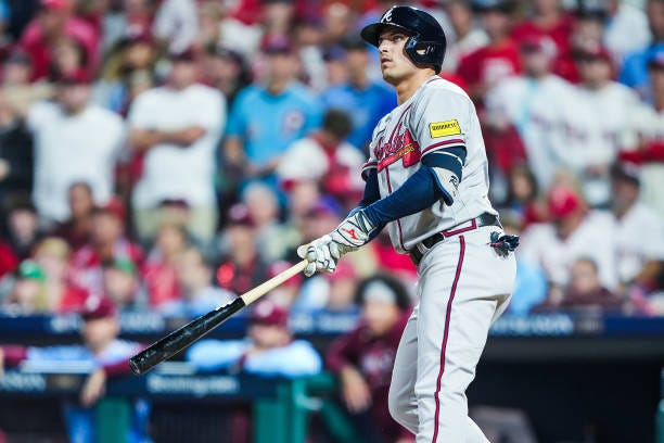 Austin Riley of the Atlanta Braves hits a solo home run against the Philadelphia Phillies during the fourth inning in Game Four of the Division...