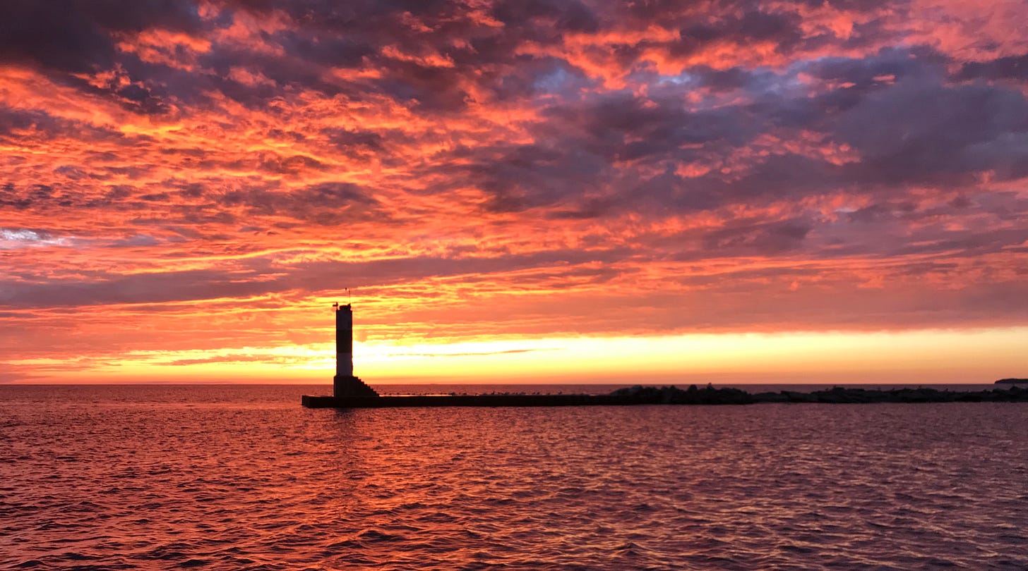 A channel marker on Lake Michigan in the sunset.