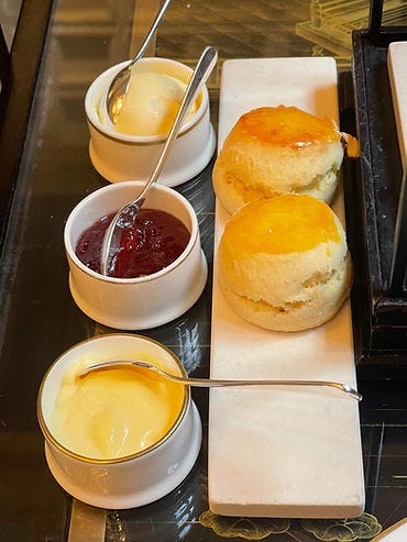 Scones with clotted cream, jam, and lemon curd