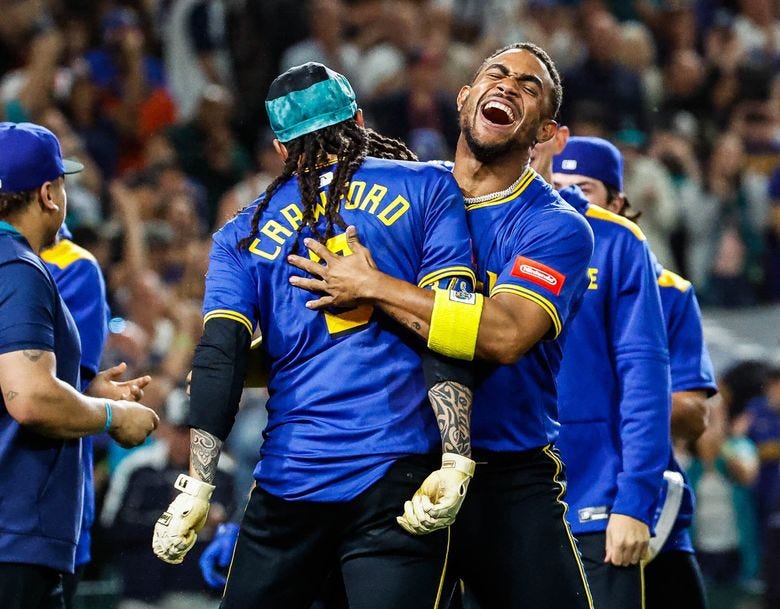 Seattle Mariners’ Julio Rodriguez celebrates with J.P. Crawford after Crawford hit a game-winning two-run home run to beat the Texas Rangers Friday, Aug. 1, 2025, in Seattle. (Dean Rutz / The Seattle Times) Seattle Mariners’ Julio Rodriguez celebrates with J.P. Crawford after Crawford hit a game-winning two-run home run to beat the Texas Rangers Friday, Aug. 1, 2025, in Seattle. (Dean Rutz / The Seattle Times)