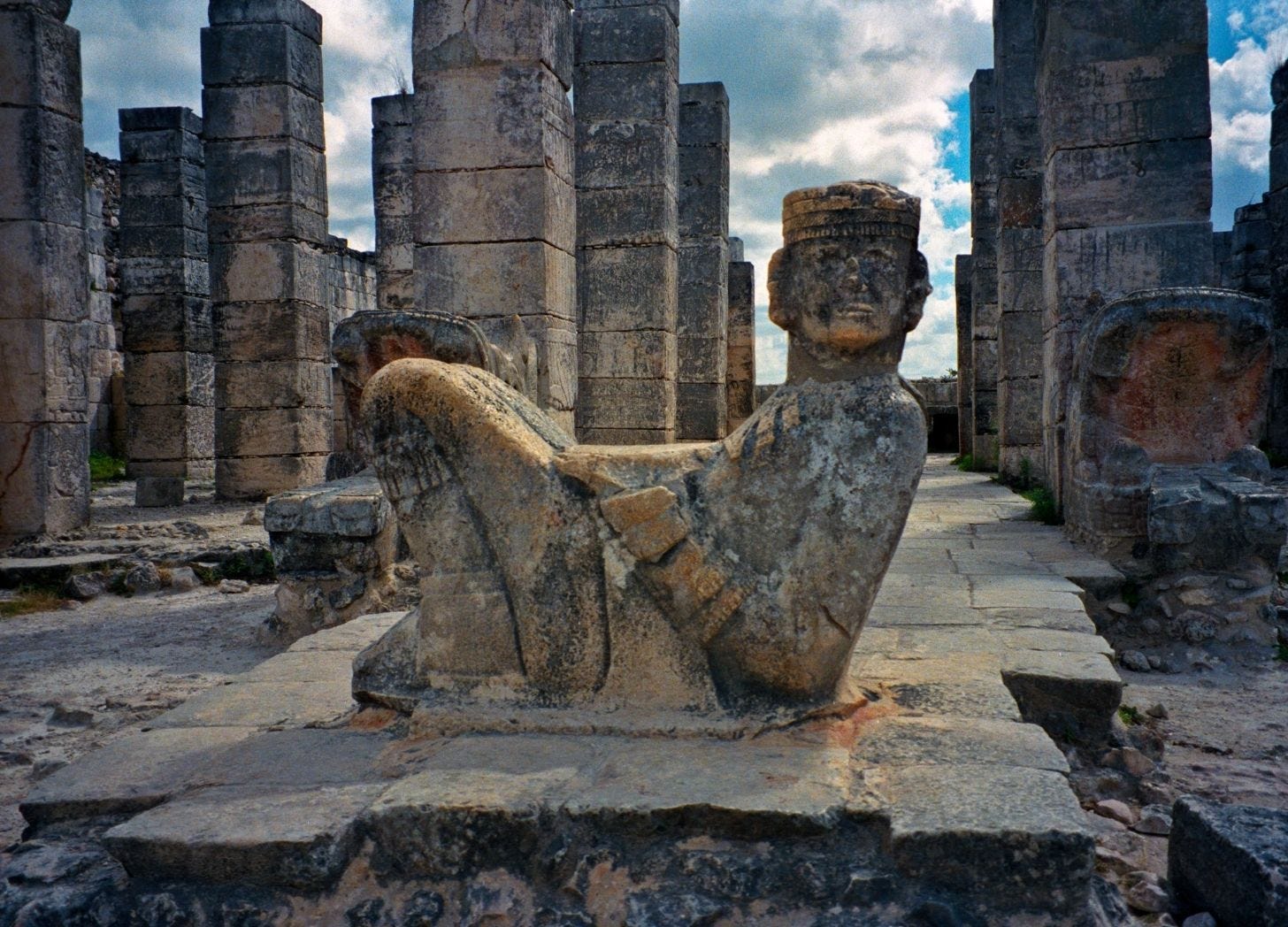 Reclining Chac Mool statue at Chichen Itza. A Mesoamerican figure on its back, head turned, bowl on its stomach. Reclining Chac Mool statue at Chichen Itza. A Mesoamerican figure on its back, head turned, bowl on its stomach.