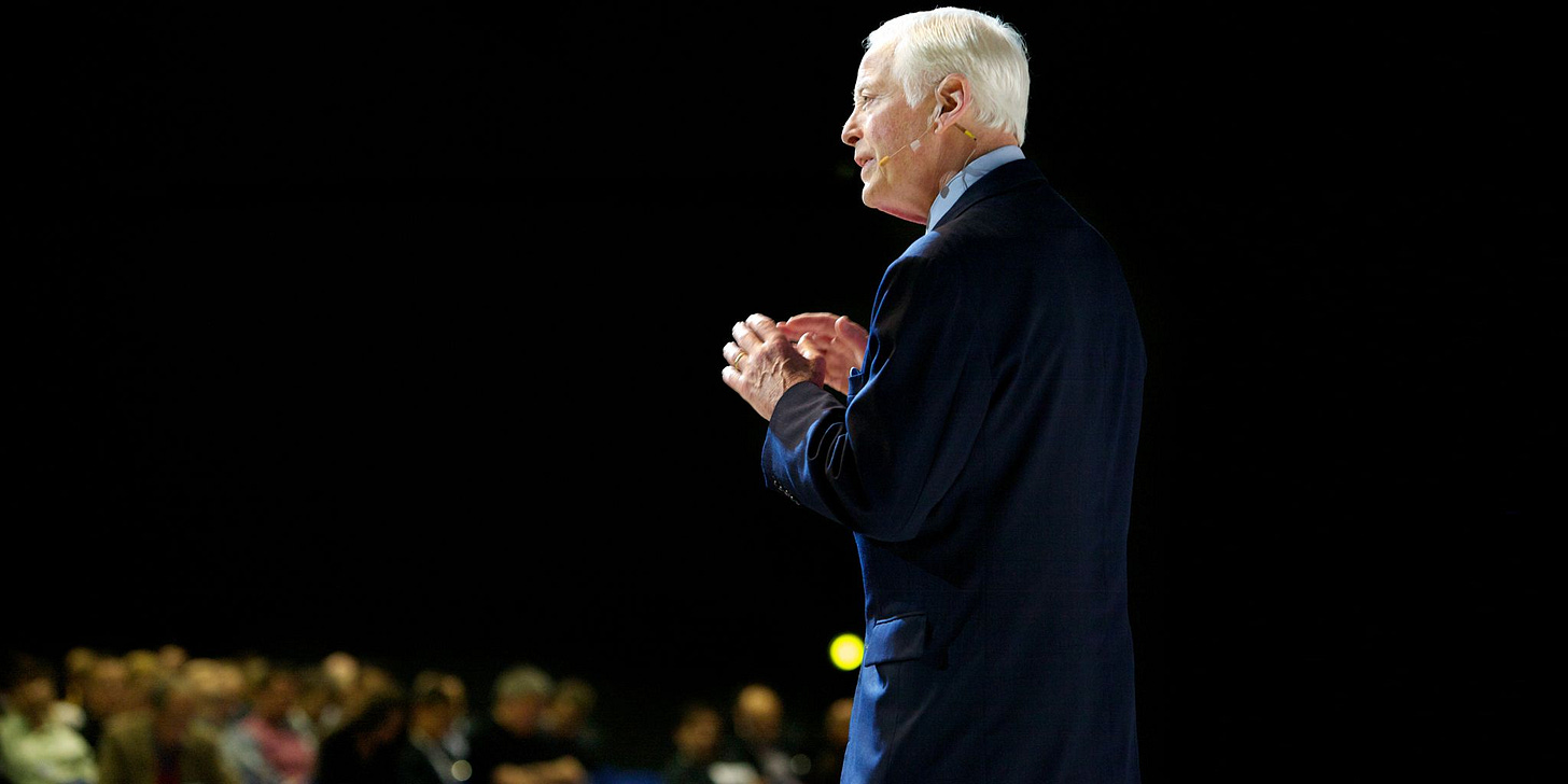 Brian Tracy, the Sales legend giving a powerful speech on stage about the best selling techniques