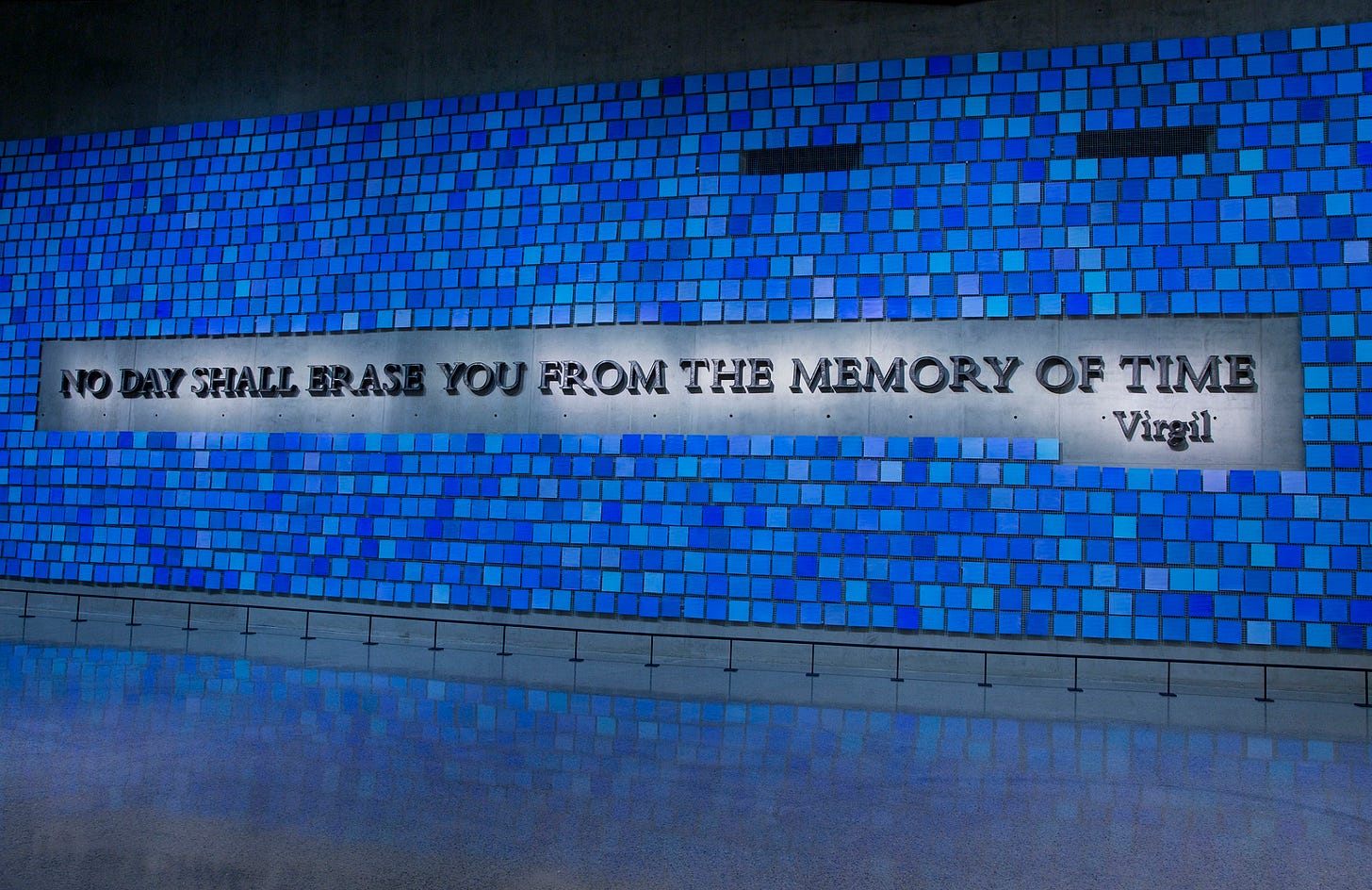 A large plaque in Memorial Hall reads, “No day shall erase you from the memory of time.” The quote from Virgil’s epic poem The Aeneid is surrounded by 2,983 individual blue tiles that comprise "Trying to Remember the Color of the Sky on That September Morning,” an installation by Spencer Finch. Every square is a unique shade of blue, reflecting the artist's attempt to remember the color of the sky on the morning of 9/11 and commemorating the victims of September 11, 2001 and February 26, 1993. 