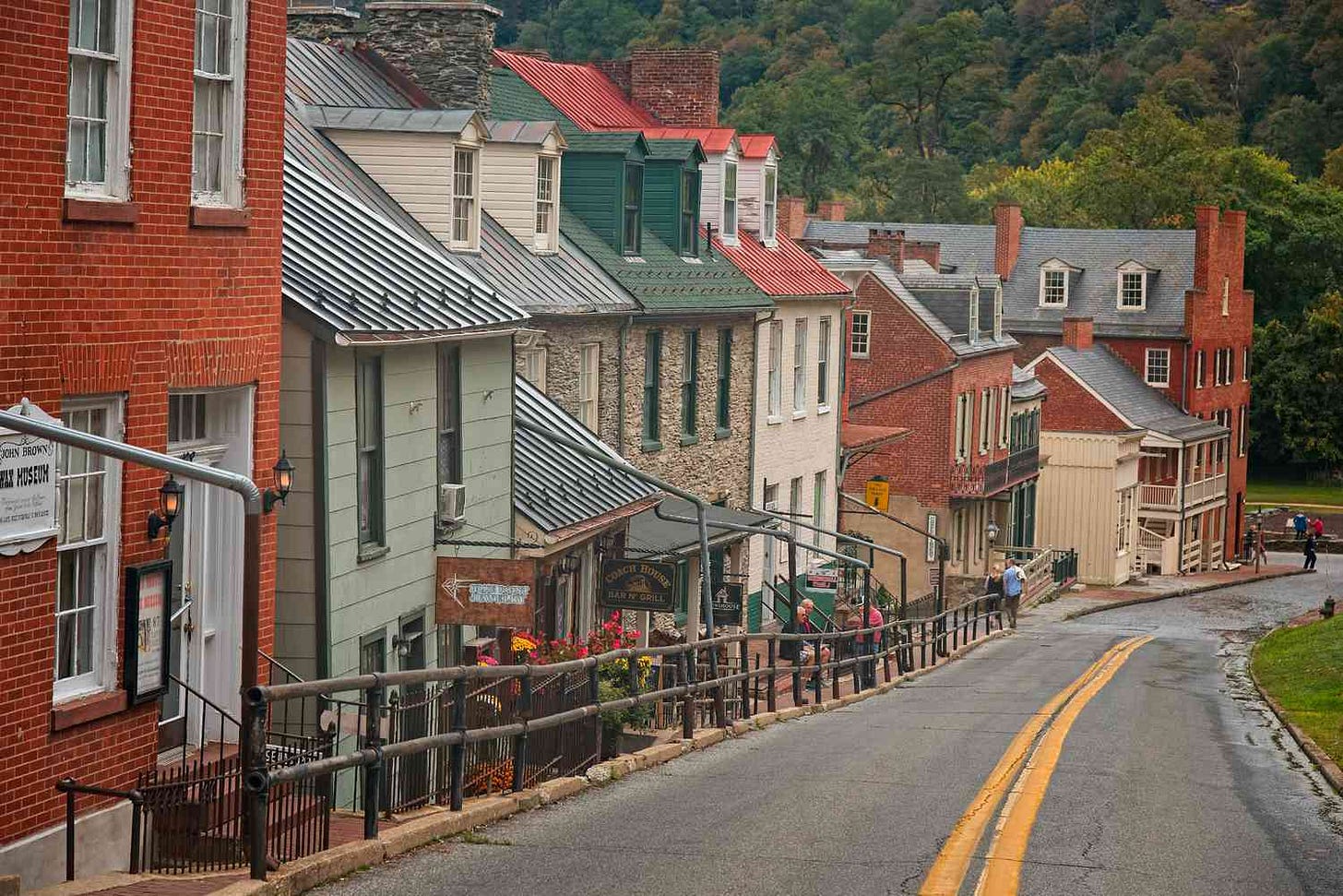 Historic buildings line the main street of a small town in West Virginia, featuring local businesses and a community atmosphere