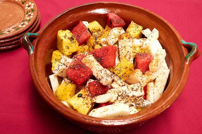 serving bowl with spicy Mexican fruit salad