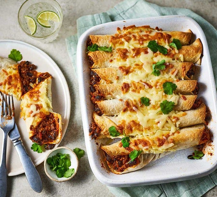 Beef enchiladas in a baking dish Beef enchiladas in a baking dish