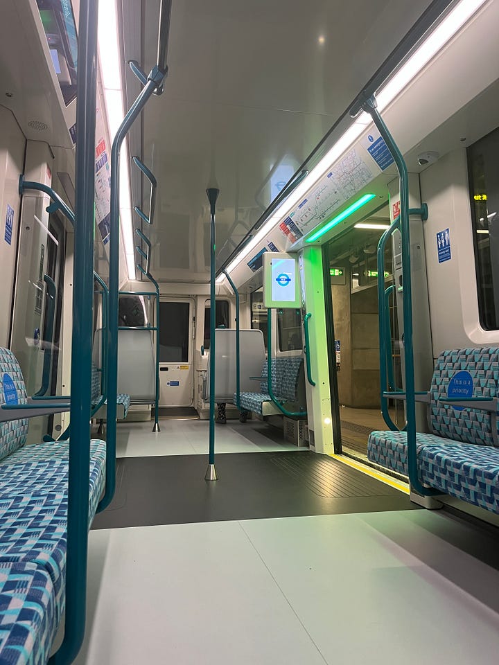 Photos showing green lighting above open doorways.