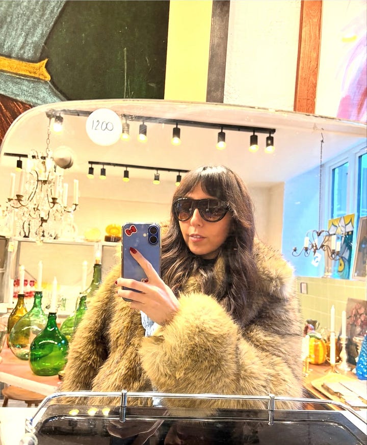 Vinyl records, neon window sign, mirror selfie, a living room with a giant disco ball