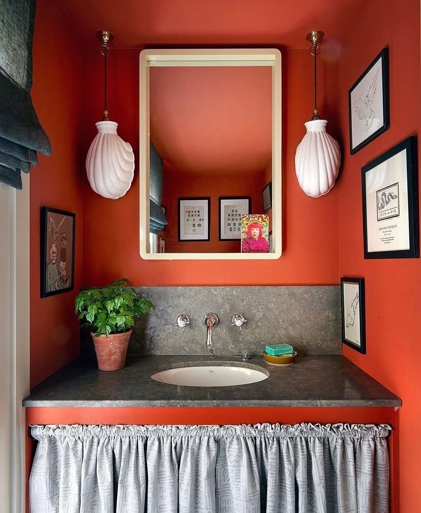 muted coral painted walls in a powder room muted coral painted walls in a powder room