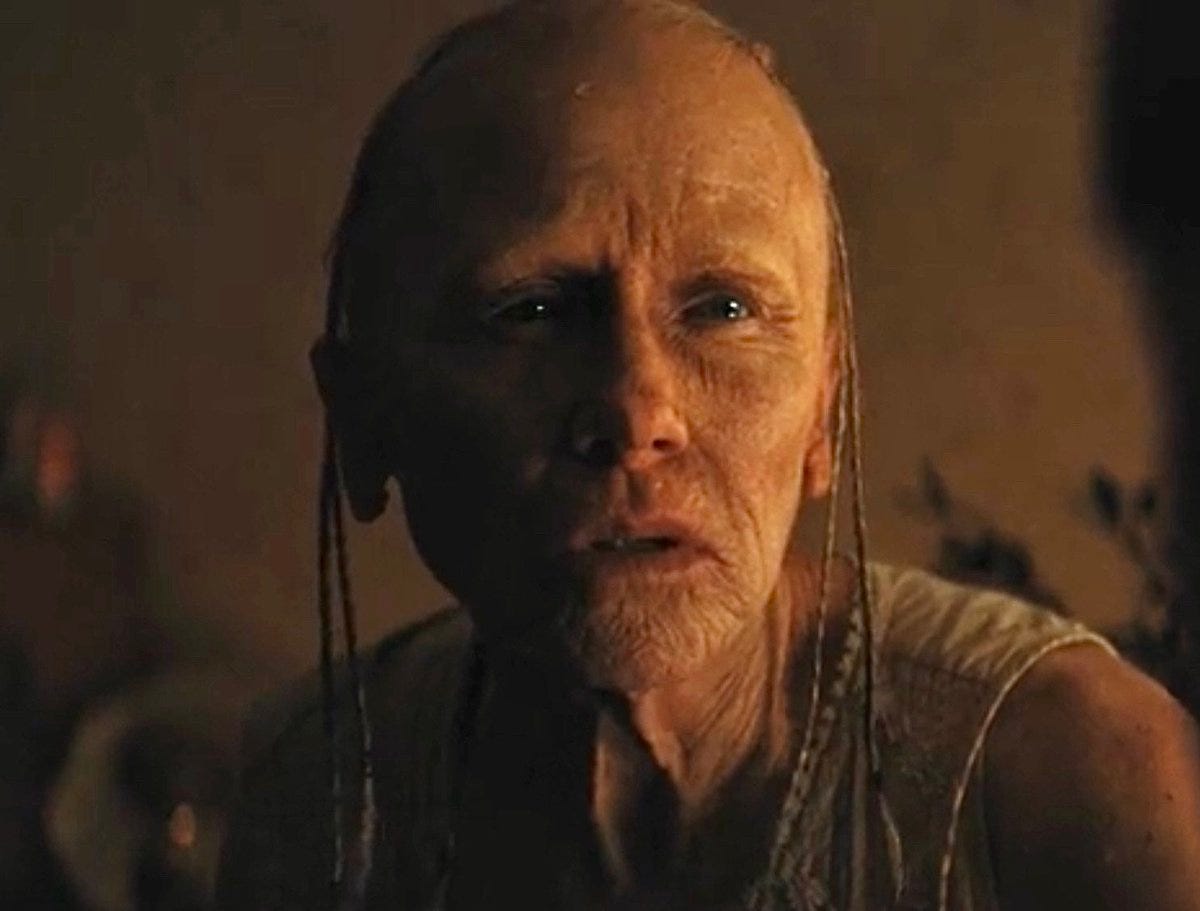 Weapons (2025) - Aunt Gladys takes off her mask.