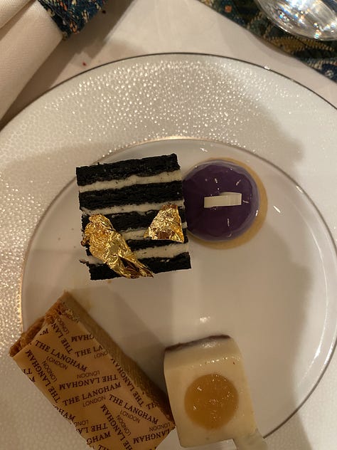 Far left is a white plate with sweet afternoon tea desserts, in the middle is a takeaway baby pink coffee cup with The Langham branding in front of a Christmas tree with lights, far right is a decorative table with afternoon tea sandwiches.