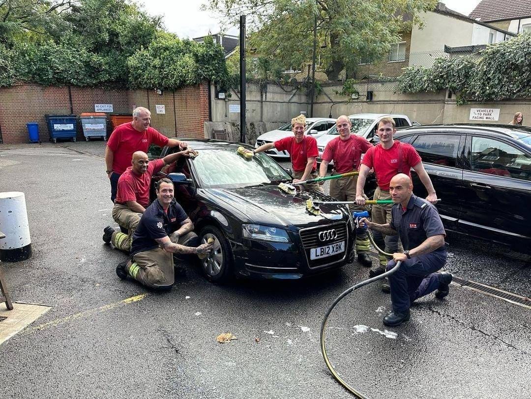 May be an image of 7 people, car and text
